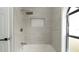 Modern shower area with white subway tile niche and rain shower head at 11494 Villa Rd, Spring Hill, FL 34609