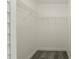 Walk-in closet with new floor and storage racks at 11494 Villa Rd, Spring Hill, FL 34609