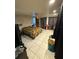 Spacious bedroom offering tiled floors, a ceiling fan, and blackout curtains at 11726 Oceanside Dr, Port Richey, FL 34668
