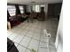 Bright living room featuring tile flooring, seating, and natural light at 11726 Oceanside Dr, Port Richey, FL 34668