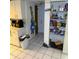 Kitchen pantry with white shelving filled with groceries and essentials at 11726 Oceanside Dr, Port Richey, FL 34668