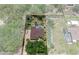 Expansive aerial view of property showcasing pool, landscaping, fire pit, and hardscaped driveway at 12403 Moneta Rd, Weeki Wachee, FL 34614