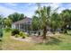 Aerial of backyard featuring enclosed pool, tropical plants, outdoor seating and gravel at 12403 Moneta Rd, Weeki Wachee, FL 34614