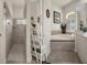 Bathroom featuring a walk-in shower and a soaking tub with tile surround at 12403 Moneta Rd, Weeki Wachee, FL 34614
