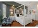 This relaxing bedroom features a four poster bed, wood floors, and soothing colors at 12403 Moneta Rd, Weeki Wachee, FL 34614