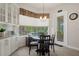 Charming breakfast nook with a table, chairs, and sliding door to the patio at 12403 Moneta Rd, Weeki Wachee, FL 34614