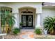Inviting front entrance with decorative columns and beautiful double doors at 12403 Moneta Rd, Weeki Wachee, FL 34614