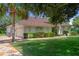 Beautiful home with a well-manicured lawn and a patterned driveway and walkway at 12403 Moneta Rd, Weeki Wachee, FL 34614
