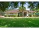 Charming home featuring lush landscaping, a well-maintained lawn, and a welcoming entrance at 12403 Moneta Rd, Weeki Wachee, FL 34614