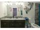 Modern bathroom featuring double vanity and granite countertops at 12458 Fish Cove Dr, Spring Hill, FL 34609
