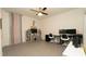 Spacious, bright bedroom with ceiling fan, perfect for a home office or playroom at 12458 Fish Cove Dr, Spring Hill, FL 34609