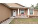 Cozy front porch with rocking chairs and a welcome sign, inviting you to relax and enjoy the neighborhood at 12458 Fish Cove Dr, Spring Hill, FL 34609