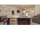 Open-concept kitchen featuring a sink, breakfast bar with granite countertop, and modern appliances at 12458 Fish Cove Dr, Spring Hill, FL 34609