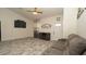 Inviting living room with gray sofa, modern flooring, decor, and lots of natural light at 12458 Fish Cove Dr, Spring Hill, FL 34609