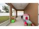 Enclosed screened lanai showcasing ample space for seating and play equipment, ideal for year-round outdoor living at 12458 Fish Cove Dr, Spring Hill, FL 34609