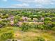 Overhead view of townhomes surrounded by verdant landscaping, creating a serene and private atmosphere at 12920 Wedgewood Way # B, Hudson, FL 34667