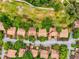 Aerial view of condo featuring mature trees, well-kept landscaping, and convenient parking at 12920 Wedgewood Way # B, Hudson, FL 34667