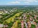 Extensive aerial view of the condo community bordering a golf course, near Tampa Road and US-19 at 12920 Wedgewood Way # B, Hudson, FL 34667