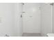 Bathroom with a tile shower and simple fixtures at 12920 Wedgewood Way # B, Hudson, FL 34667