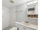 Bathroom featuring a shower and sink at 12920 Wedgewood Way # B, Hudson, FL 34667