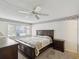 Bedroom with wall-to-wall carpet, floral wallpaper and a large window at 12920 Wedgewood Way # B, Hudson, FL 34667