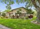 Exterior of community clubhouse with neat landscaping, creating a welcoming space for residents at 12920 Wedgewood Way # B, Hudson, FL 34667