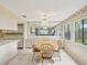 Charming dining room with a window view and wooden table, perfect for Gathering meals at 12920 Wedgewood Way # B, Hudson, FL 34667