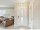 Bright entryway showcasing a front door with glass insert and tile flooring at 12920 Wedgewood Way # B, Hudson, FL 34667