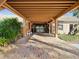 Inviting entryway with brick flooring and covered walkway, leading to a welcoming community building at 12920 Wedgewood Way # B, Hudson, FL 34667