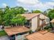 Well-maintained condo with carport parking, private entrance staircase, and balcony at 12920 Wedgewood Way # B, Hudson, FL 34667