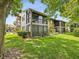 Charming condo with mature trees, and a large screened-in patio overlooking the lawn at 12920 Wedgewood Way # B, Hudson, FL 34667