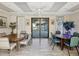 Bright game room with multiple tables, chairs, and a view of the community pool through sliding glass doors at 12920 Wedgewood Way # B, Hudson, FL 34667