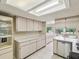 Well-lit kitchen with extensive countertop space and storage at 12920 Wedgewood Way # B, Hudson, FL 34667