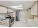 Kitchen featuring stainless steel appliances and abundant cabinet space at 12920 Wedgewood Way # B, Hudson, FL 34667