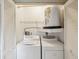 Laundry room features a side-by-side washer and dryer, water heater, and storage space at 12920 Wedgewood Way # B, Hudson, FL 34667