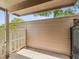 Exterior patio features a small fence separating neighboring units at 12920 Wedgewood Way # B, Hudson, FL 34667