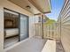 Exterior patio features a small fence separating neighboring units at 12920 Wedgewood Way # B, Hudson, FL 34667