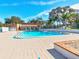 Inviting community pool offers a refreshing escape with clear blue water and comfortable lounging areas at 12920 Wedgewood Way # B, Hudson, FL 34667