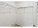 Walk-in closet with built-in shelving at 12920 Wedgewood Way # B, Hudson, FL 34667