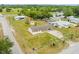 Aerial view of a single-Gathering home with a long driveway and spacious front and back yards at 12936 Parkwood St, Hudson, FL 34669