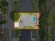 Aerial view of the property featuring a private pool and well-maintained landscaping at 13248 Linzia Ln, Spring Hill, FL 34609