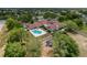 Aerial view of the community featuring a pool, playground, and well-maintained landscaping at 13248 Linzia Ln, Spring Hill, FL 34609