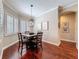 Cozy breakfast nook featuring natural light, stylish chandelier, and comfortable seating for four at 13248 Linzia Ln, Spring Hill, FL 34609