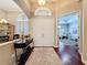 Elegant foyer featuring hardwood floors, a decorative rug, and a view into a bright, open living space at 13248 Linzia Ln, Spring Hill, FL 34609