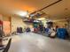 Spacious two-car garage, ideal for storage and workshop activities, with shelving and equipment at 13248 Linzia Ln, Spring Hill, FL 34609