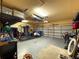 The garage has ample space for storage and vehicles, with shelving and an open layout at 13248 Linzia Ln, Spring Hill, FL 34609