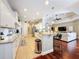 Modern eat-in kitchen featuring a breakfast bar that opens into the living room at 13248 Linzia Ln, Spring Hill, FL 34609