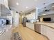 Spacious kitchen featuring stainless steel appliances and granite countertops offers plenty of counter space at 13248 Linzia Ln, Spring Hill, FL 34609