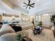 Spacious living room featuring hardwood floors, an open floor plan, and access to the kitchen at 13248 Linzia Ln, Spring Hill, FL 34609