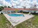 Relaxing community pool with ample seating and tables for outdoor enjoyment at 13248 Linzia Ln, Spring Hill, FL 34609